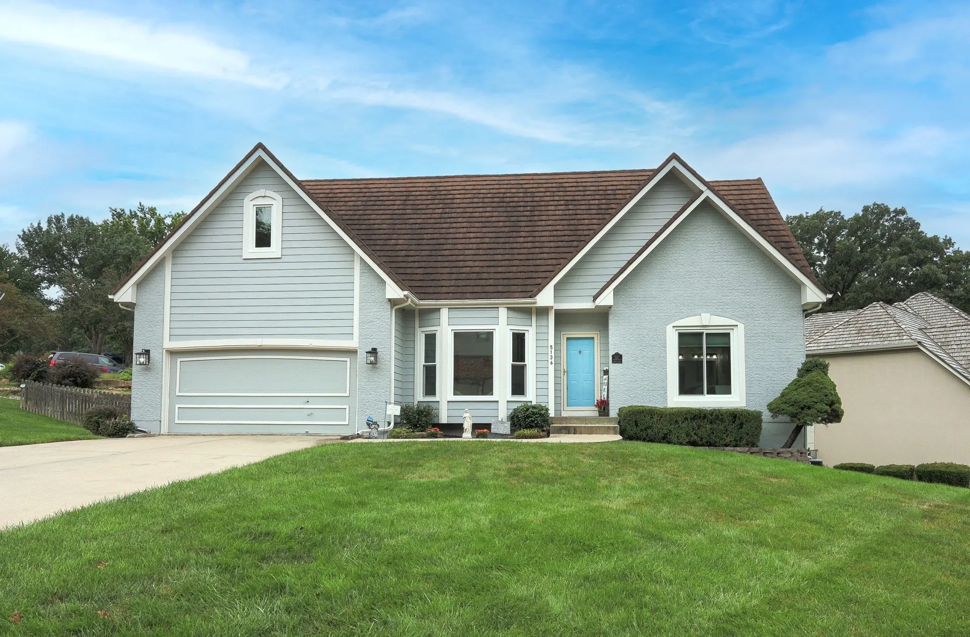 Two-story Kansas City home with a fresh exterior paint job