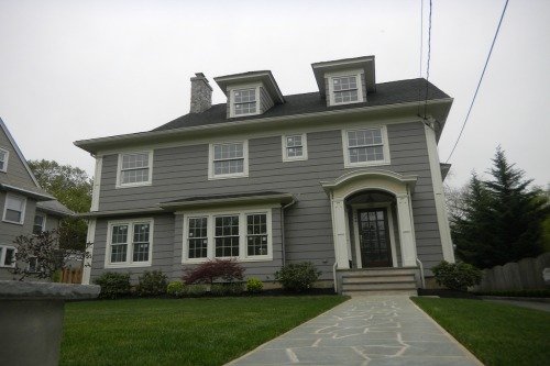 Catalyst Painting crew prepping and painting a home exterior